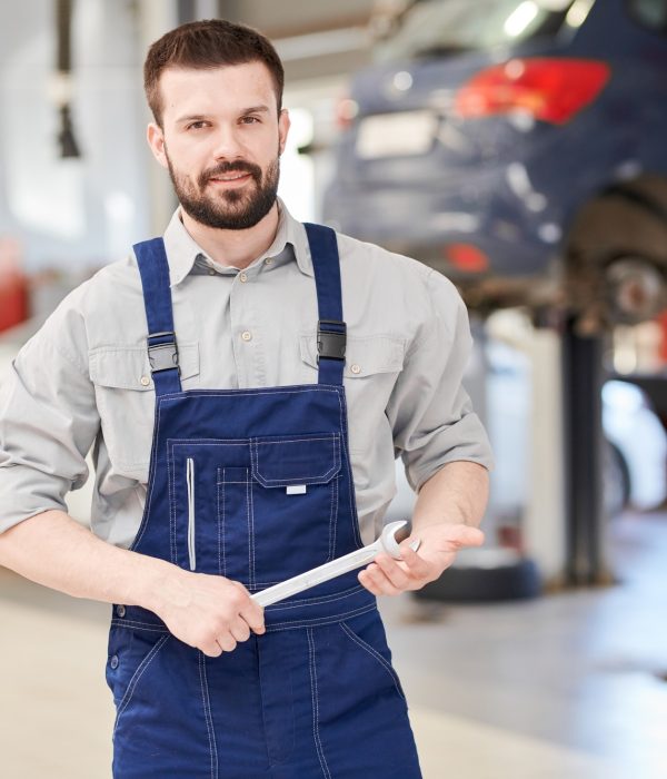 Car Mechanic Posing in Workshop